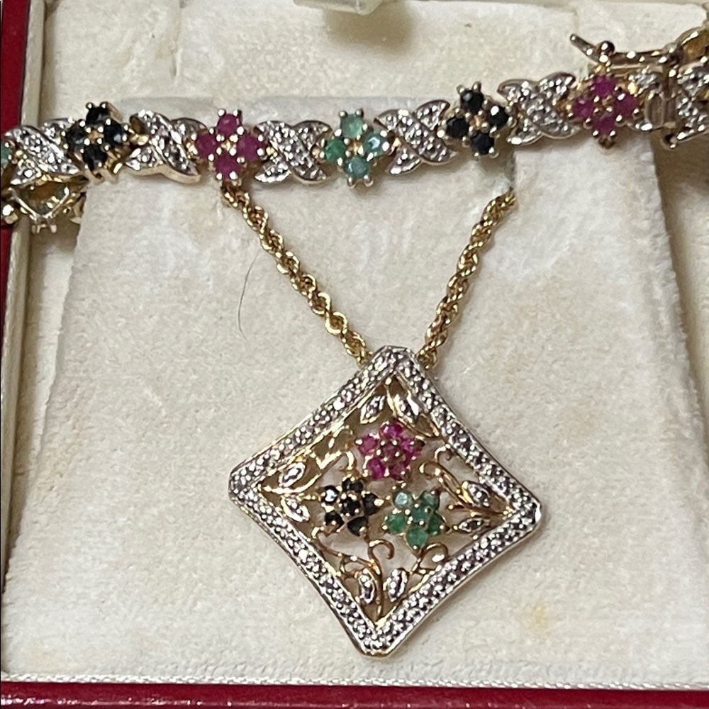 10k sterling, emerald, sapphire, and ruby set. (Bracelet and pendant only)